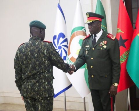 General sworn in as new Guinea-Bissau leader, ousted president arrives in Senegal